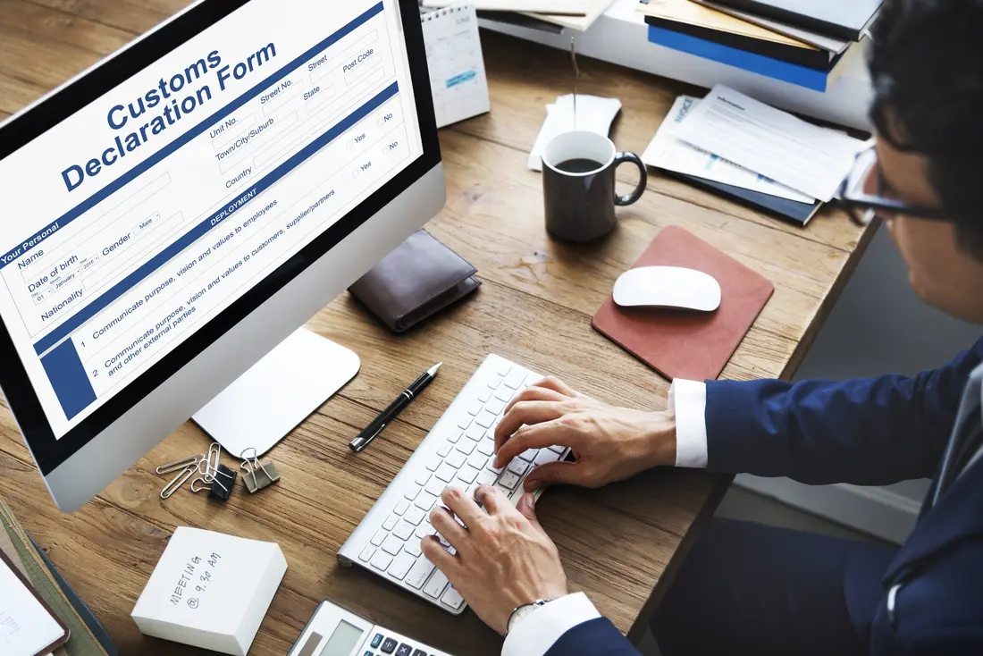 Broker completing a customs declaration form